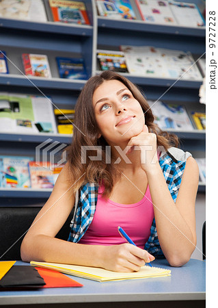 Beautiful female student in a university library 9727228