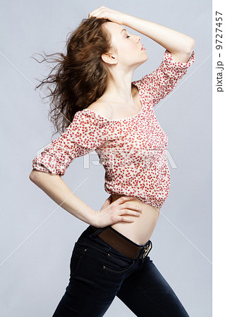 Beautiful red-haired model studio portrait 9727457