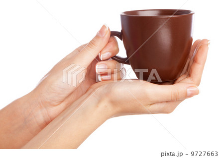 Female hand holding a cup Female hand holding a cup 9727663