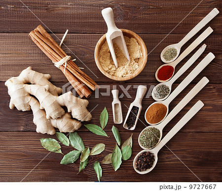 Spice assortment on a wooden table 9727667
