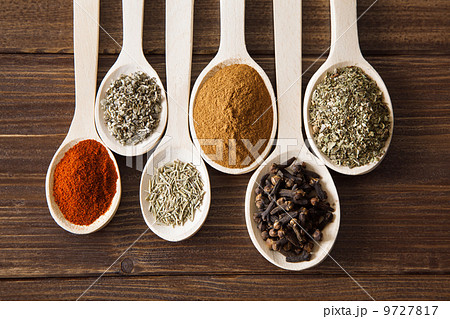 Spice assortment on a wooden table 9727817