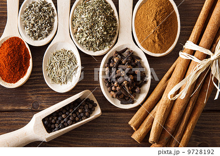 Spice assortment on a wooden table 9728192