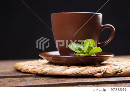 Tea with mint on a wooden table 9728341