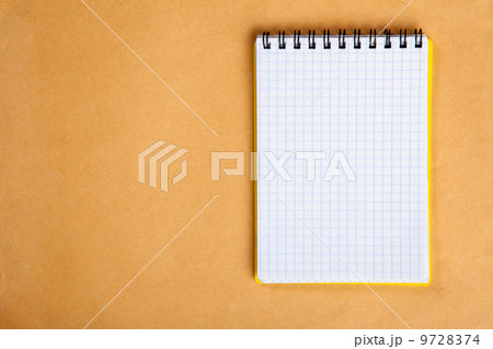 Notepad on a wooden table Notepad on a wooden table 9728374