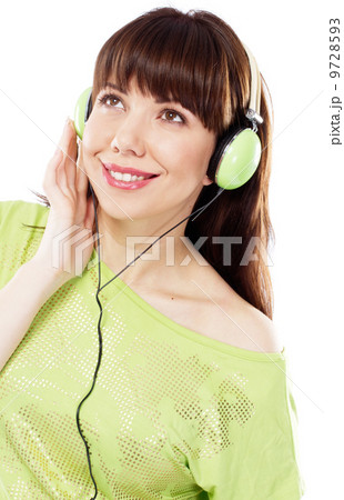Beautiful girl with green headphones 9728593