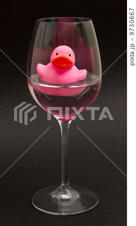 Pink rubber duck in a wineglass Pink rubber duck in a wineglass 9730667