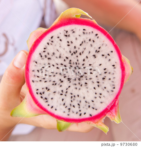 Woman holding a dragon fruit Woman holding a dragon fruit 9730680