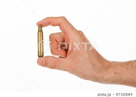 Hand holding an empty cartridge 9730884