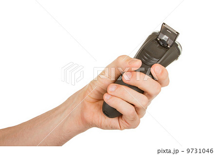 Hand holding an electric shaver 9731046
