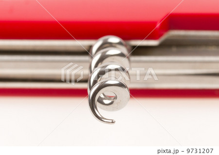 Red swiss army knife isolated, focus on corkscrew 9731207