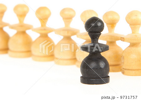 Old handcarved chess pieces isolated 9731757