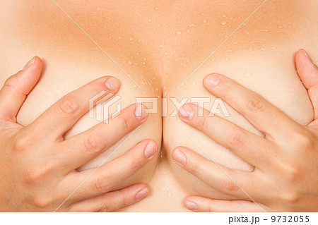 Hands covering breasts 9732055