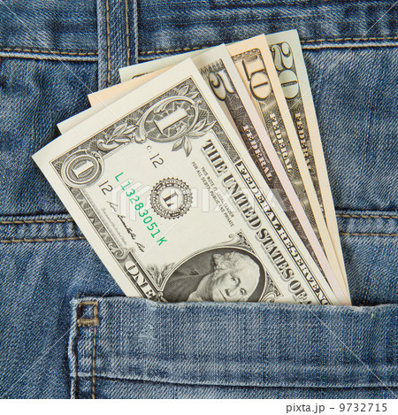 Macro shot of trendy jeans with american four different dollar b Macro shot of trendy jeans with american four different dollar b 9732715