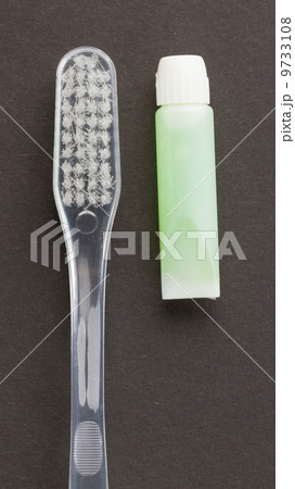 Toothbrush and green toothpaste isolated 9733108