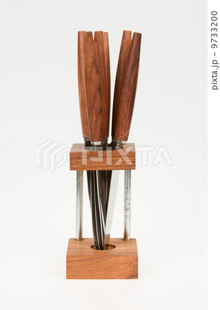 Very old set of knives in a stand, isolated 9733200