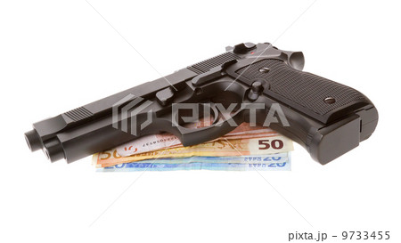 Semi-automatic gun with some euro bills isolated 9733455