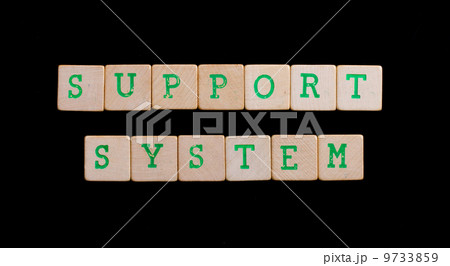 Green letters on old wooden blocks (support, system) 9733859