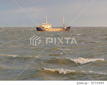 Small coastal vessel in the waters of the dutch Ijsselmeer Small coastal vessel in the waters of the dutch Ijsselmeer 9733995