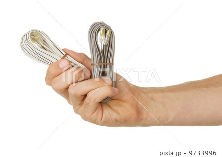Speaker cable in a hand, isolated 9733996