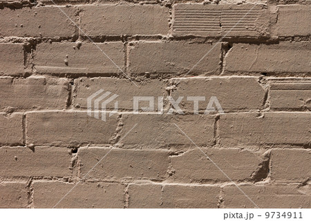 Yellow paint brick wall background 9734911