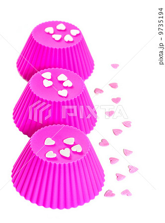 Pink  silicone baking cups.  Isolated on white background 9735194