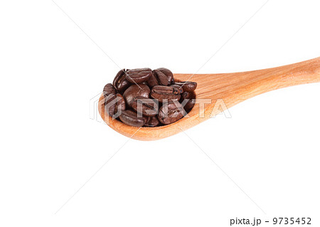 Coffee beans on wooden spoon 9735452