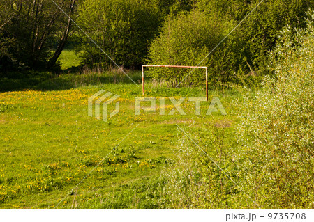 Rural soccer field with white goal posts Rural soccer field with white goal posts 9735708