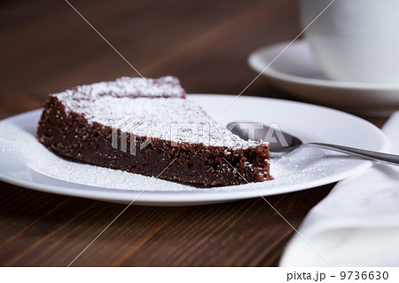 Chocolate Cake Slice on white dish Chocolate Cake Slice on white dish 9736630