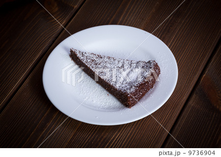 Chocolate Cake Slice on white dish 9736904