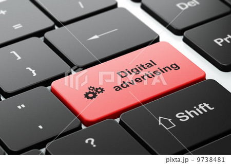 Advertising concept: Gears and Digital Advertising on computer keyboard background 9738481