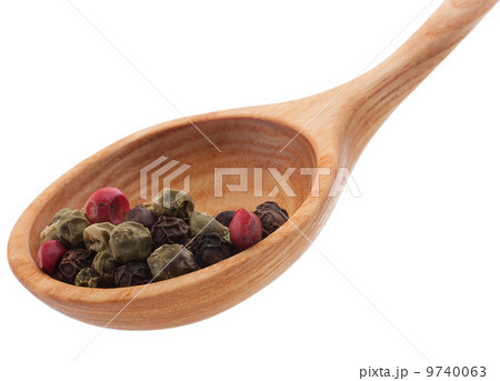 Pepper seasoning mix in wooden spoon isolated on white backgrou Pepper seasoning mix in wooden spoon isolated on white backgrou 9740063
