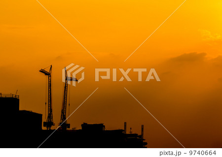 construction cranes silhouettes 9740664
