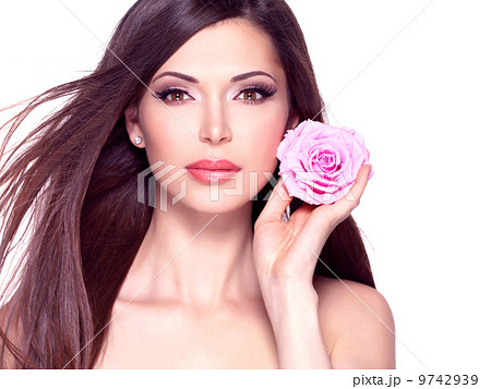beautiful pretty woman with long hair and pink rose at face. 9742939