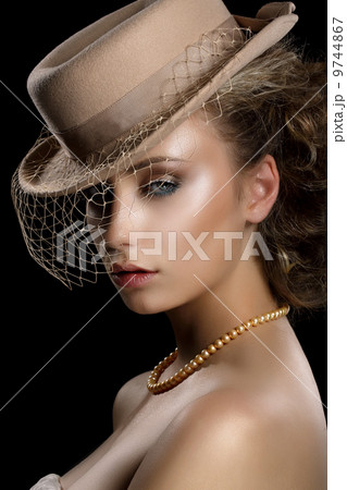 Charm. Retro Styled Romantic Woman in Vintage Brown Hat and Veil. Nostalgia 9744867
