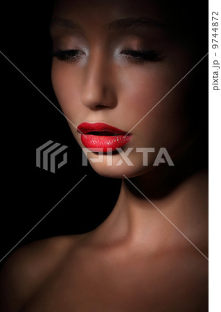 Accent. Highlight. Glamorous Exotic Asian Woman in Shadows. Evening Makeup 9744872