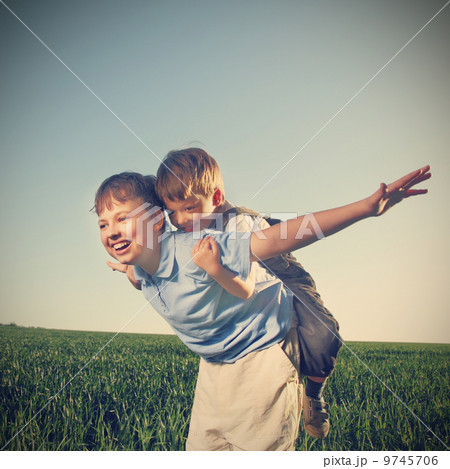 two brathers outdoors happy play two brathers outdoors happy play 9745706