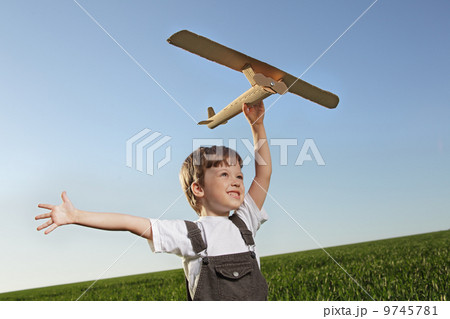 children with airplan toy outdoors 9745781