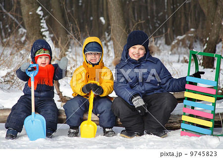 three boy play on snow three boy play on snow 9745823