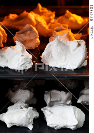 sweet dessert meringue on oven trays 9747301