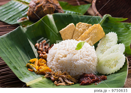 nasi lemak, a traditional malay curry paste rice dish served on 9750635
