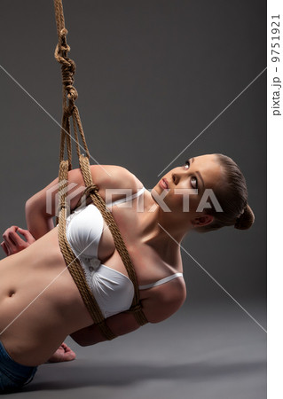 Image of pretty young woman hanging on rope - Stock Photo [9751921] - PIXTA