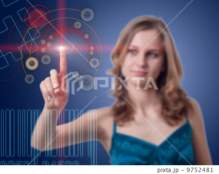 Young woman presses the button on the high-tech screen Young woman presses the button on the high-tech screen 9752481