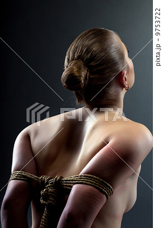 Rear view of girl's hands tightened rope Rear view of girl's hands tightened rope 9753722