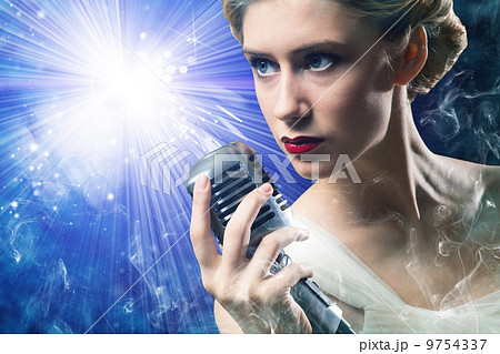 attractive female singer with microphone 9754337