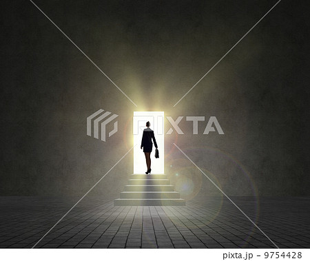 business woman standing near an open door 9754428