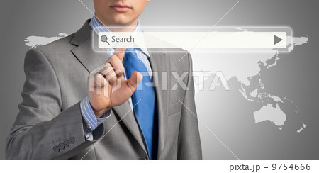Businessman pushing on a touch screen Businessman pushing on a touch screen 9754666