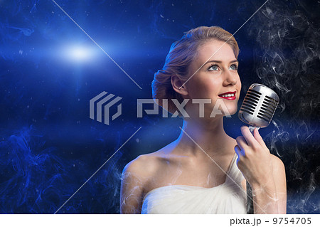 attractive female singer with microphone 9754705
