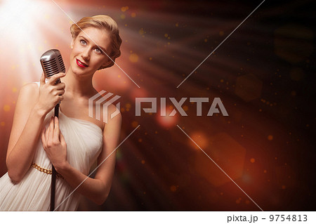 attractive female singer with microphone 9754813