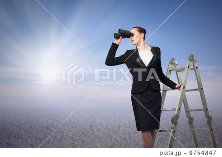 businesswoman looking through binoculars 9754847