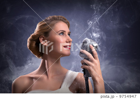 beautiful blonde woman singer with a microphone beautiful blonde woman singer with a microphone 9754947
